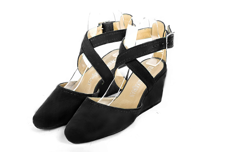Matt black women's open back shoes, with crossed straps. Round toe. Medium wedge heels. Front view - Florence KOOIJMAN